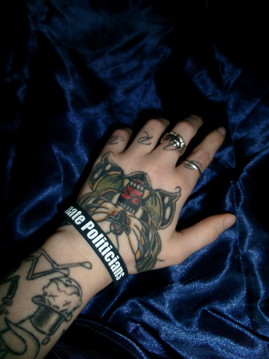 “I VOTE TO ASSASSINATE POLITICIANS” navy wristband